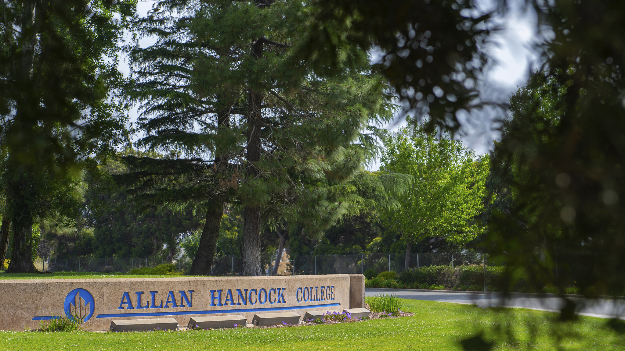 Front of school with Allan Hancock College sign