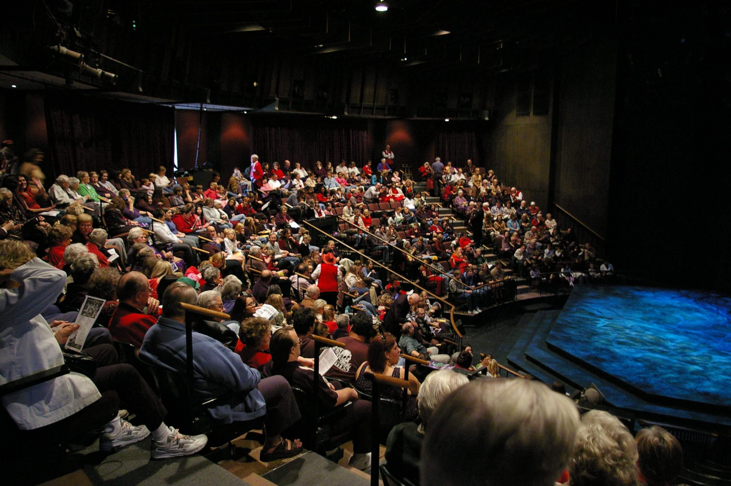 Interior photo of Marian Theatre with patrons in seats