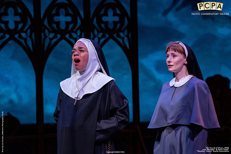 Two actors playing nuns signing in Sound of Music