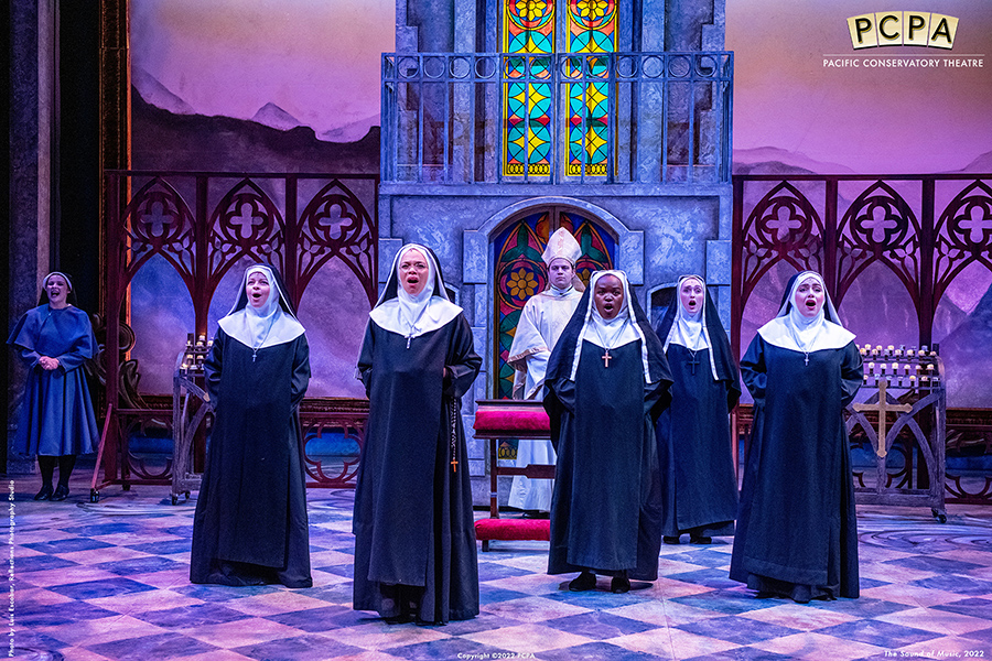 Actors playing nuns singing onstage in Sound of Music